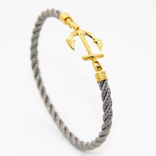 Bracelet homme en acier avec boucle en or 18K, design moderne et robuste.