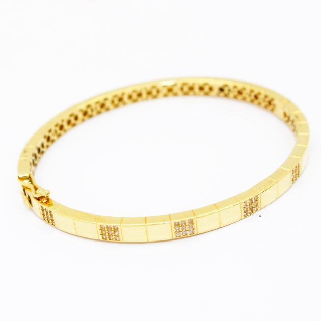 Bracelet moderne en or 18K, design minimaliste et élégant.